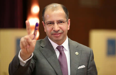 FILE PHOTO: Iraqi Speaker of Parliament Salim al-Jabouri shows his ink-stained finger after casting his vote at a polling station during the parliamentary election in Baghdad, Iraq May 12, 2018. REUTERS/Ahmed Jadallah/File Photo