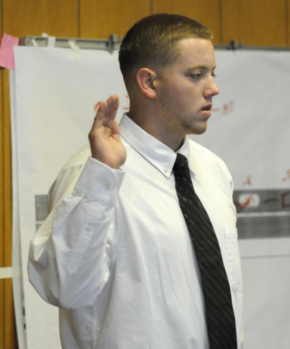 Defendant Aaron Deveau, 18, takes the oath prior to taking the stand at Haverhill District Court in Haverhill, Mass. Tuesday, June 5, 2012, where he is on trial on charges of motor vehicle homicide while texting. Authorities say the then-17-year-old Deveau was texting when he crossed the center line of a Haverhill street on Feb. 20, 2011 and crashed into a vehicle driven by 55-year-old Donald Bowley of Danville, N.H., who died 18 days later in the hospital. (AP Photo/Eagle Tribune, Paul Bilodeau, Pool)