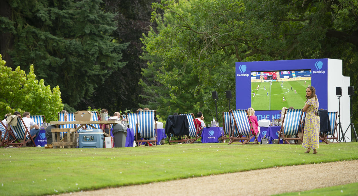 KING'S LYNN, ENGLAND - AUGUST 01: People watch the match as Prince William, Duke of Cambridge hosts an outdoor screening of the Heads Up FA Cup final on the Sandringham Estate on August 1, 2020 in King's Lynn, England. (Photo by Tim Merry - WPA Pool/Getty Images)
