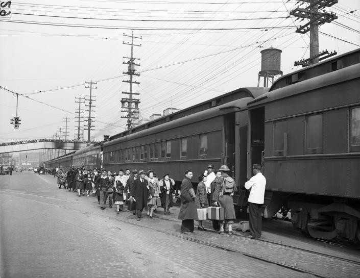 A evacuation of Japanese Americans near Seattle in 1942.