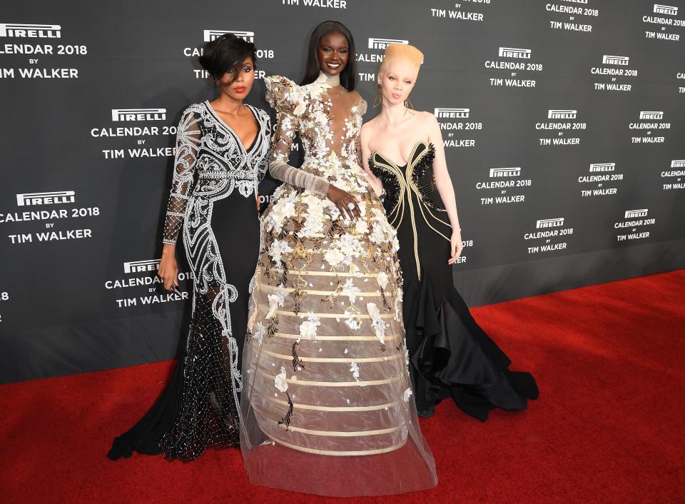 Pirelli 2018 calendar models Jaha Dukureh, Duckie Thot, and Thando Hopa on the red carpet. (Photo: Getty Images)