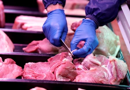 Pork for sale is seen at a market in Beijing