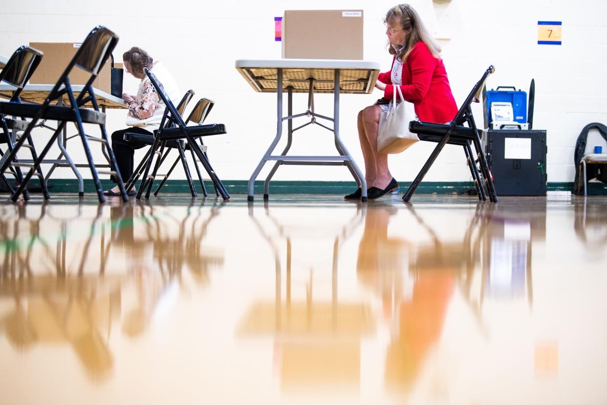 Voters fill out their ballots Nov. 7 at Deane Hill Recreation Center. A new state law is forcing the city to change its election system.