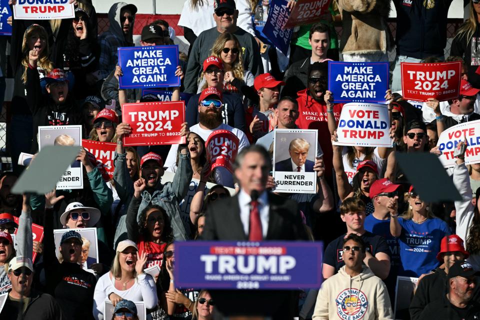 Supporters of former US President and 2024 Republican presidential candidate Donald Trump listen to North Dakota Governor Doug Burgum speak during a campaign rally in Wildwood, New Jersey, on May 11, 2024. Trump indicated Saturday that he is not considering his former Republican rival Nikki Haley for vice president. The 77-year-old real estate tycoon, who hopes to return to the White House, has everyone guessing about whom he will pick as his running mate in the November vote.