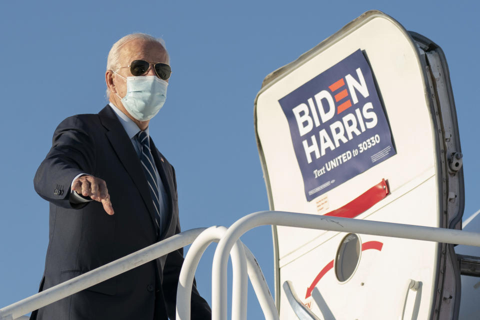 Democratic presidential candidate former Vice President Joe Biden boards his campaign plane at Raleigh-Durham International Airport in Morrisville, N.C., Sunday, Oct. 18, 2020, en route to Wilmington, Del. (AP Photo/Carolyn Kaster)