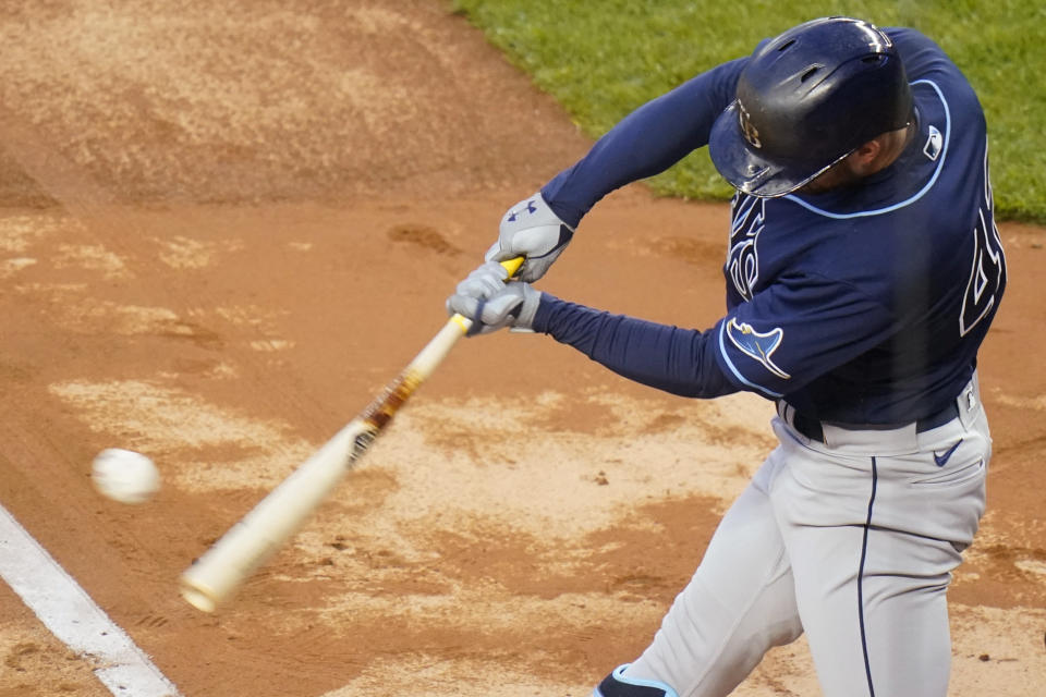 Tampa Bay Rays' Brandon Lowe hits a two-run double during the first inning of a baseball game against the New York Yankees on Friday, April 16, 2021, in New York. (AP Photo/Frank Franklin II)