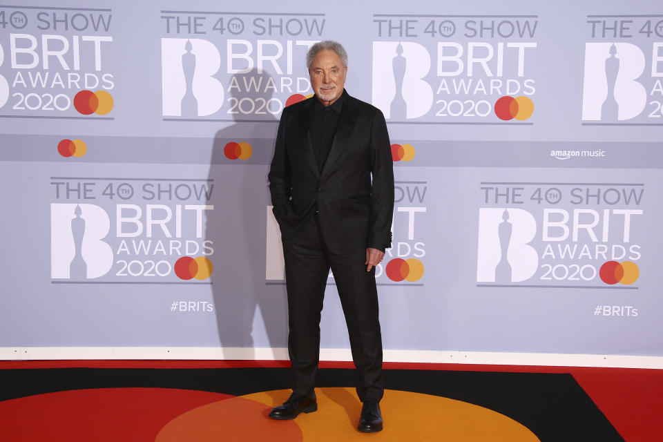 Singer Tom Jones poses for photographers upon arrival at the Brit Awards 2020 in London, Tuesday, Feb. 18, 2020. (Photo by Joel C Ryan/Invision/AP)