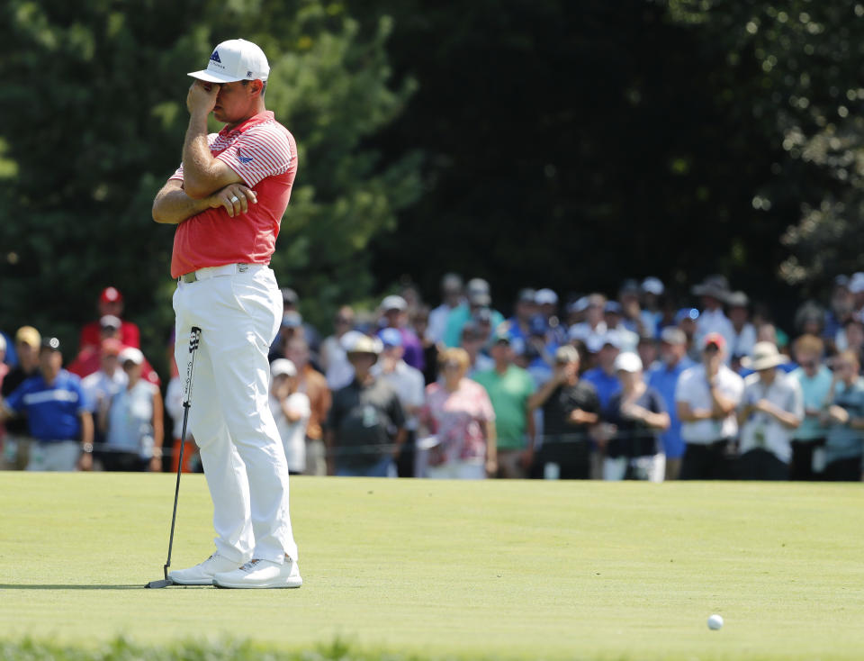 Gary Woodland reacts after missing a putt on the fifth green during the second round of the PGA Championship golf tournament at Bellerive Country Club, Friday, Aug. 10, 2018, in St. Louis. (AP Photo/Jeff Roberson)