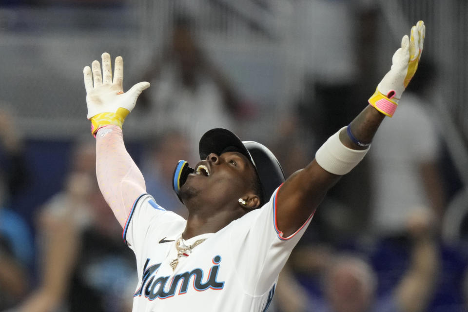 Miami Marlins' Jazz Chisholm Jr. celebrates as he crosses home plate after hitting a grand slam during the third inning of a baseball game against the Atlanta Braves, Sunday, Sept. 17, 2023, in Miami. (AP Photo/Lynne Sladky)