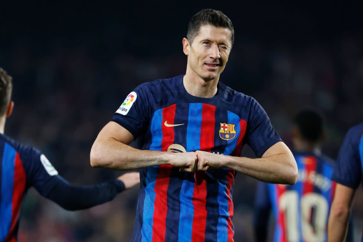 Barcelona’s Robert Lewandowski celebrates after scoring his side’s second goal in the win against Cadiz (Joan Monfort/AP) (AP)