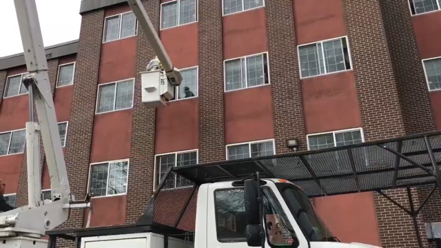 Nick Avtges, 88, goes up in a bucket truck to visit wife, Marion, at her nursing home since she is under quarantine. (Photo: Chris Avtges)