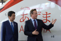 Prime Minister David Cameron (R) and Japanese Prime Minister Shinzo Abe tour the Hitachi North Pole train maintenance Depot in West London, as Abe has warned that Brexit would make the UK "less attractive" to Japanese investors, May 5, 2016. REUTERS/Anthony Devlin/Pool