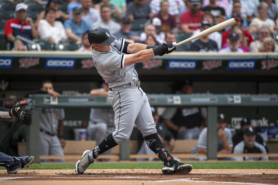 Chicago White Sox's Andrew Vaughn hits a two-run single off Minnesota Twins pitcher Devin Smeltzer during the first inning of a baseball game Friday, July 15, 2022, in Minneapolis. (AP Photo/Craig Lassig)