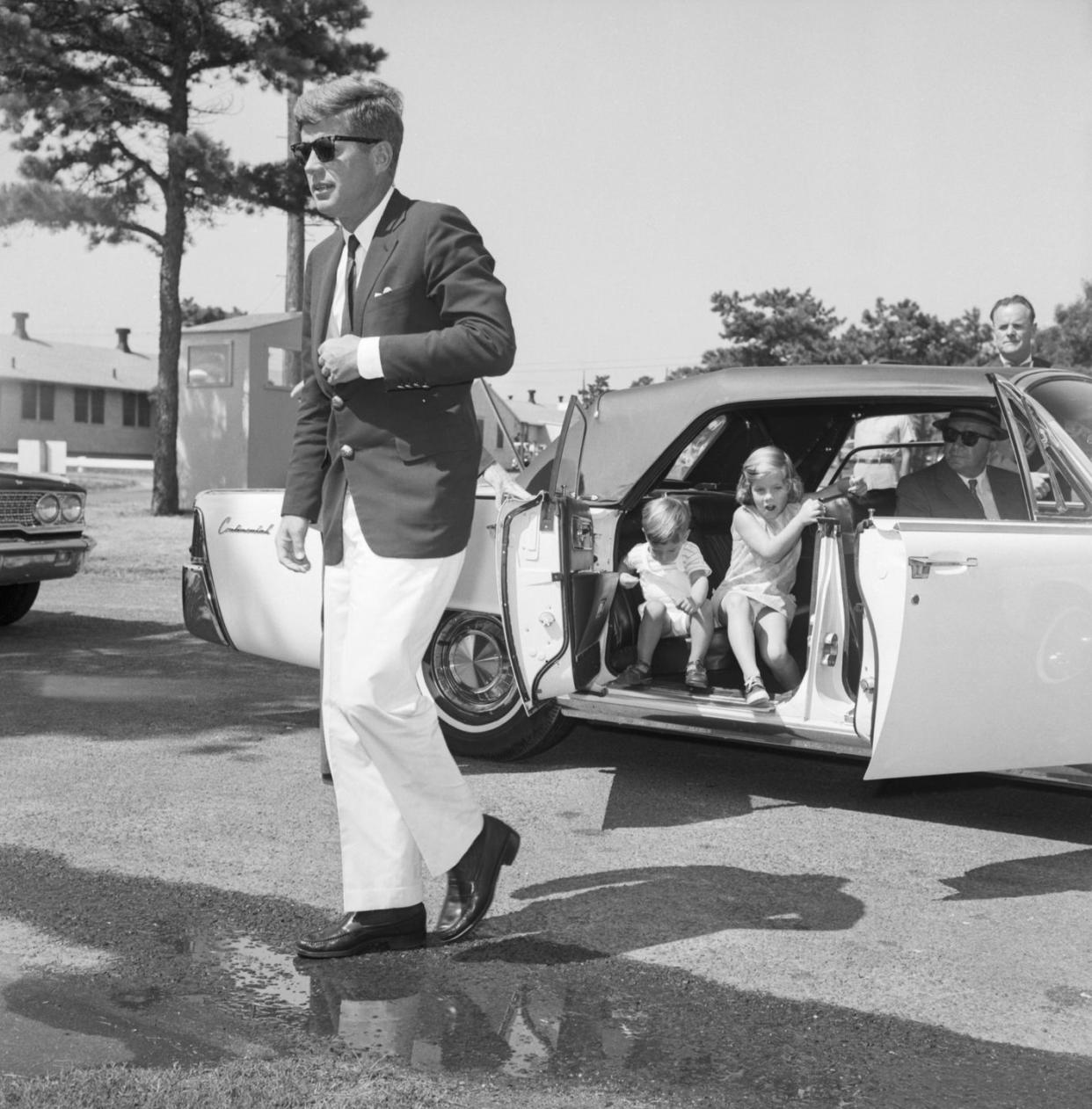 john f kennedy and his children getting out of car