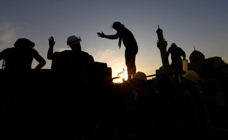 Demonstrators block Al Shuhada bridge during ongoing anti-government protests, in Baghdad