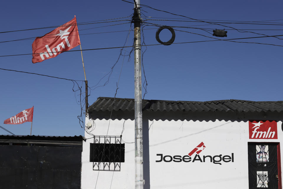 The Farabundo Martí National Liberation Front, FMLN, party flags fly from a home in Cuscatancingo, El Salvador, Sunday, April 4, 2021. On Feb. 28, the FMLN suffered a drubbing in the national elections. Some question whether with its four remaining federal legislators, down from 23 before the election, the party can even survive. (AP Photo/Salvador Melendez)