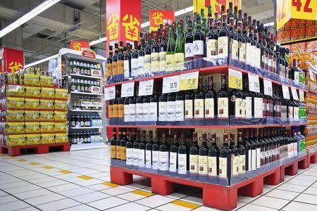 Shelves displaying wines on discount are pictured at a supermarket in Shanghai, China, October 29, 2015. REUTERS/Aly Song