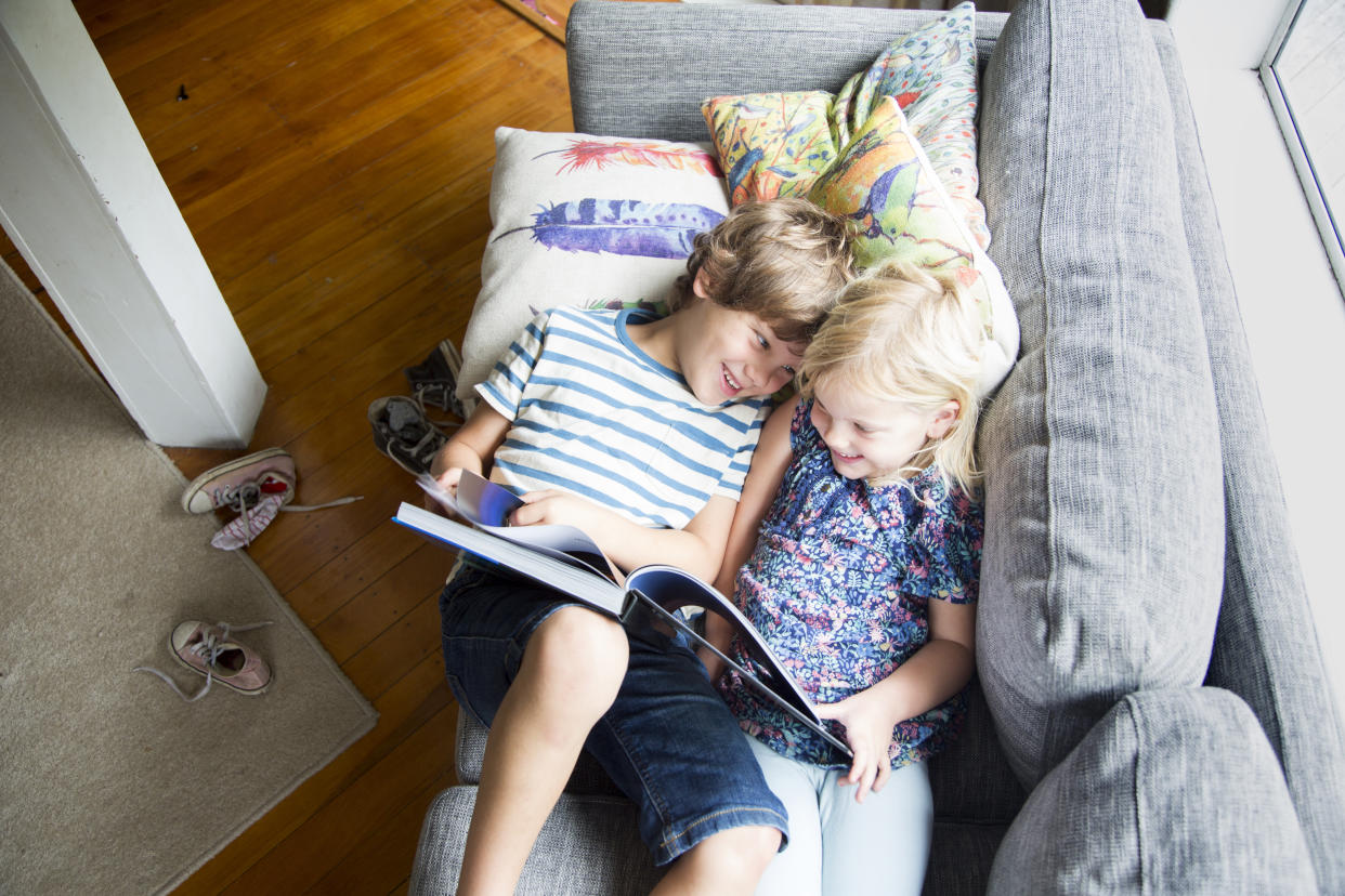 Children enjoying reading at home. (Getty Images)