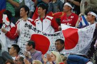 Japan fans hold a large flag during the men's gymnastics team final in the North Greenwich Arena at the London 2012 Olympic Games July 30, 2012. REUTERS/Brian Snyder (BRITAIN - Tags: OLYMPICS SPORT GYMNASTICS) 