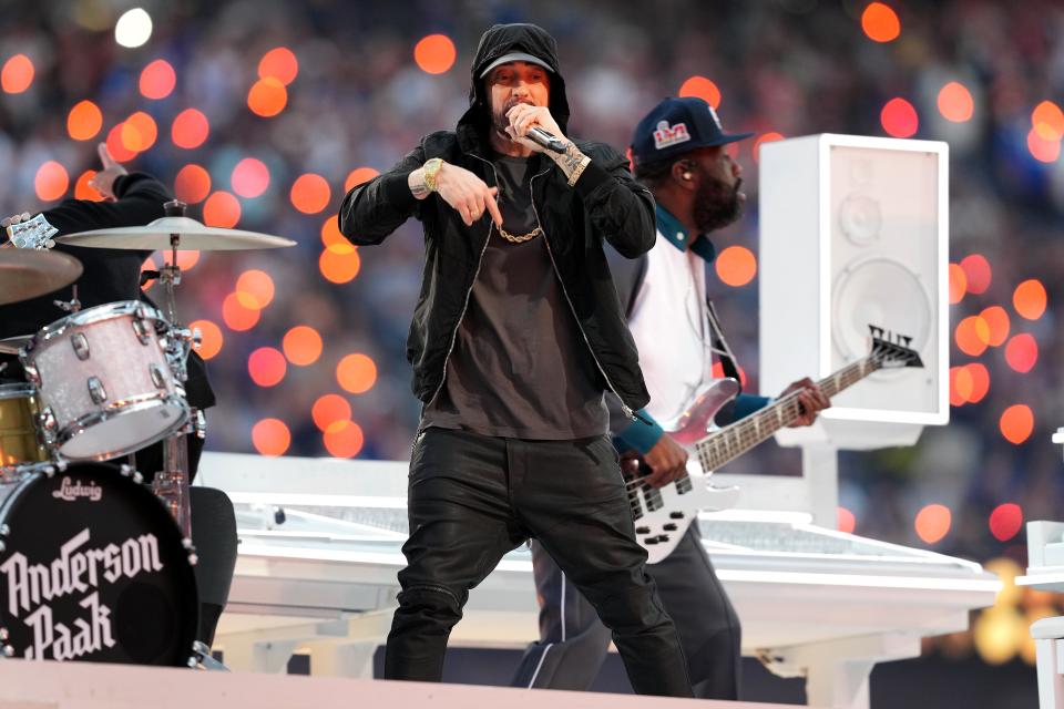 Eminem performs during halftime of the 2022 Super Bowl between the Los Angeles Rams and the Cincinnati Bengals on Feb. 13 at SoFi Stadium in Inglewood, Calif. The Cincinnati Bengals lost, 23-20. Delaware resident Adam Blackstone, right, is shown playing the bass. He was a musical director for the show.