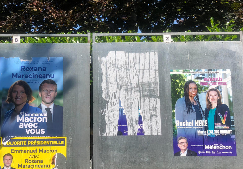 Electoral posters of presidential candidate Roxana Maracineanu and Rachel Keke are seen Thursday, June 16, 2022 in Thiais, south of Paris. Rachel Keke, a Black woman who fought for the rights of her hotel chambermaids co-workers has become the symbol of the recent revival of the French left. Roxana Maracineanu, born in Romania, arrived in France with her family in 1984, and was naturalized French seven years. She later became the first world champion in French swimming history and silver medalist at the 2000 Sydney Olympics. (AP Photo/Jade Le Deley)