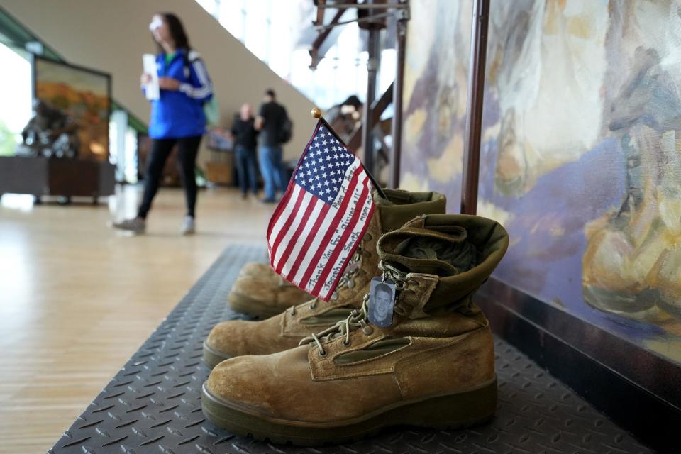 The "Eyes of Freedom" traveling exhibition, which commemorates the 22 Marines and one Navy corpsman killed in action during the Columbus-based Lima Company's deployment in 2005 during the war in Iraq, is currently on display at the National Veterans Memorial and Museum. It is comprised of eight large panels with life-sized portraits of those killed, as well as candles, plaques with their names, and a pair of combat boots in front of each portrait.