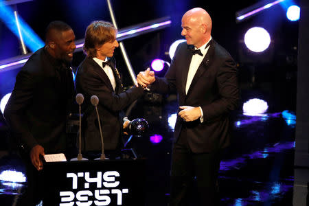 Soccer Football - The Best FIFA Football Awards - Royal Festival Hall, London, Britain - September 24, 2018 FIFA President Gianni Infantino presents Luka Modric with the Best Men's Player award Action Images via Reuters/John Sibley