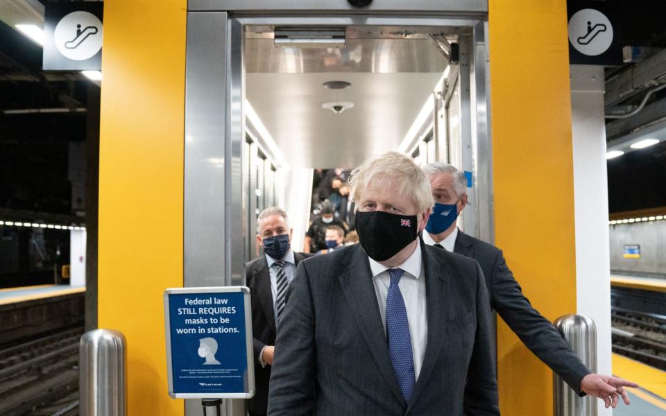 Boris Johnson prepares to board a train from Penn Station in New York to Washington DC where he will meet US President Biden later today. - PA