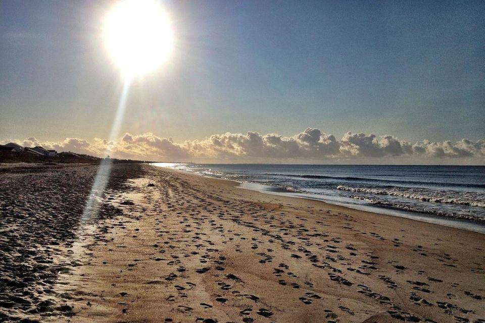 Lee Dingle died on a family trip to the beach at Oak Island, pictured (Doug Anderson / Wikipedia)