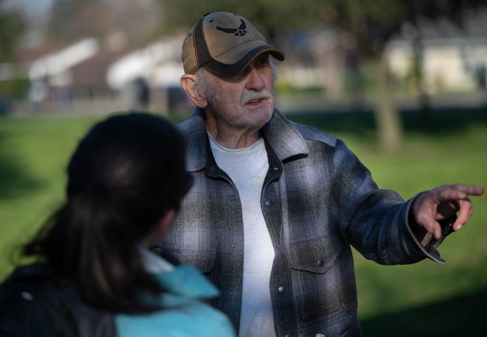 Volunteers Tiffany Ornells talks with David Turner during Stanislaus County’s point in time count of the homeless population in Modesto, Calif., Thursday, Jan. 26, 2023.