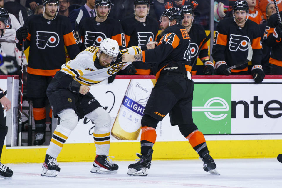 Philadelphia Flyers' Nicolas Deslauriers, right, gets into a fight with Boston Bruins' A.J. Greer, left, during the third period of an NHL hockey game, Sunday, April 9, 2023, in Philadelphia. The Bruins won 5-3.(AP Photo/Chris Szagola)