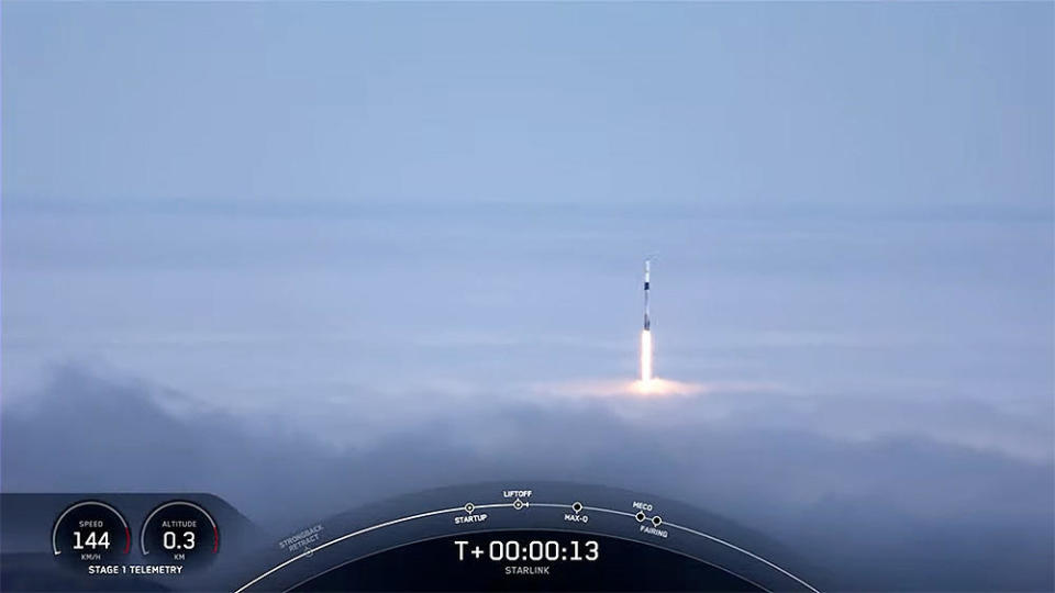 A SpaceX Falcon 9 rocket launched from Vandenberg Space Force Base in California breaks out of heavy fog moments after liftoff Thursday in the company's 32nd flight so far this year. / Credit: SpaceX webcast