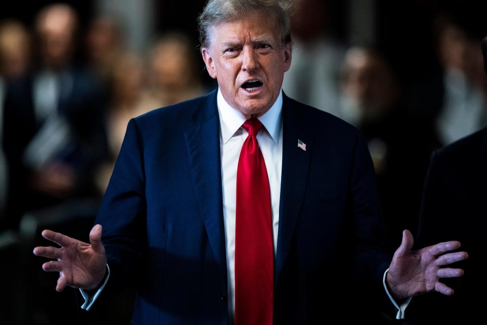 Former President Donald Trump arrives at the courtroom during the first day of his trial for allegedly covering up hush money payments linked to extramarital affairs, at Manhattan Criminal Court in New York City on April 15, 2024.