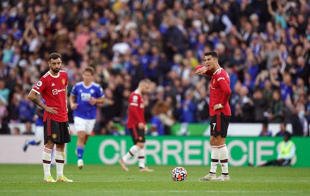 Cristiano Ronaldo stands dejected with Bruno Fernandes