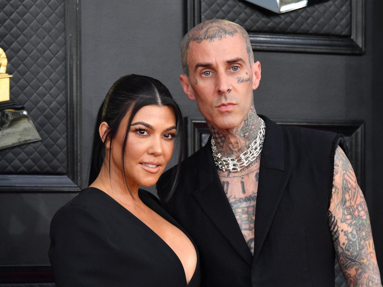 Kourtney Kardashian and musician Travis Barker arrive for the 64th Annual Grammy Awards at the MGM Grand Garden Arena in Las Vegas on April 3, 2022.