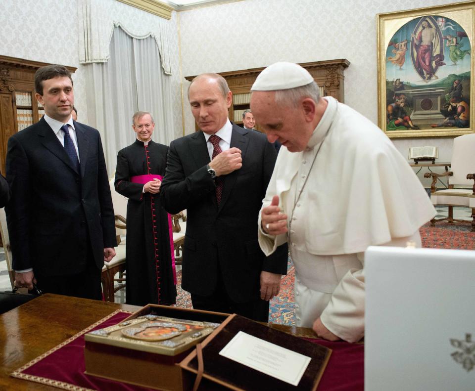 Pope Francis exchanges gifts with Russia's President Vladimir Putin during a private audience at the Vatican