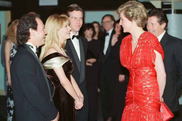 <p>Kent Gavin/Daily Mirror/Mirrorpix/Getty</p> Princess Diana, Billy Crystal, Meg Ryan and Dennis Quaid