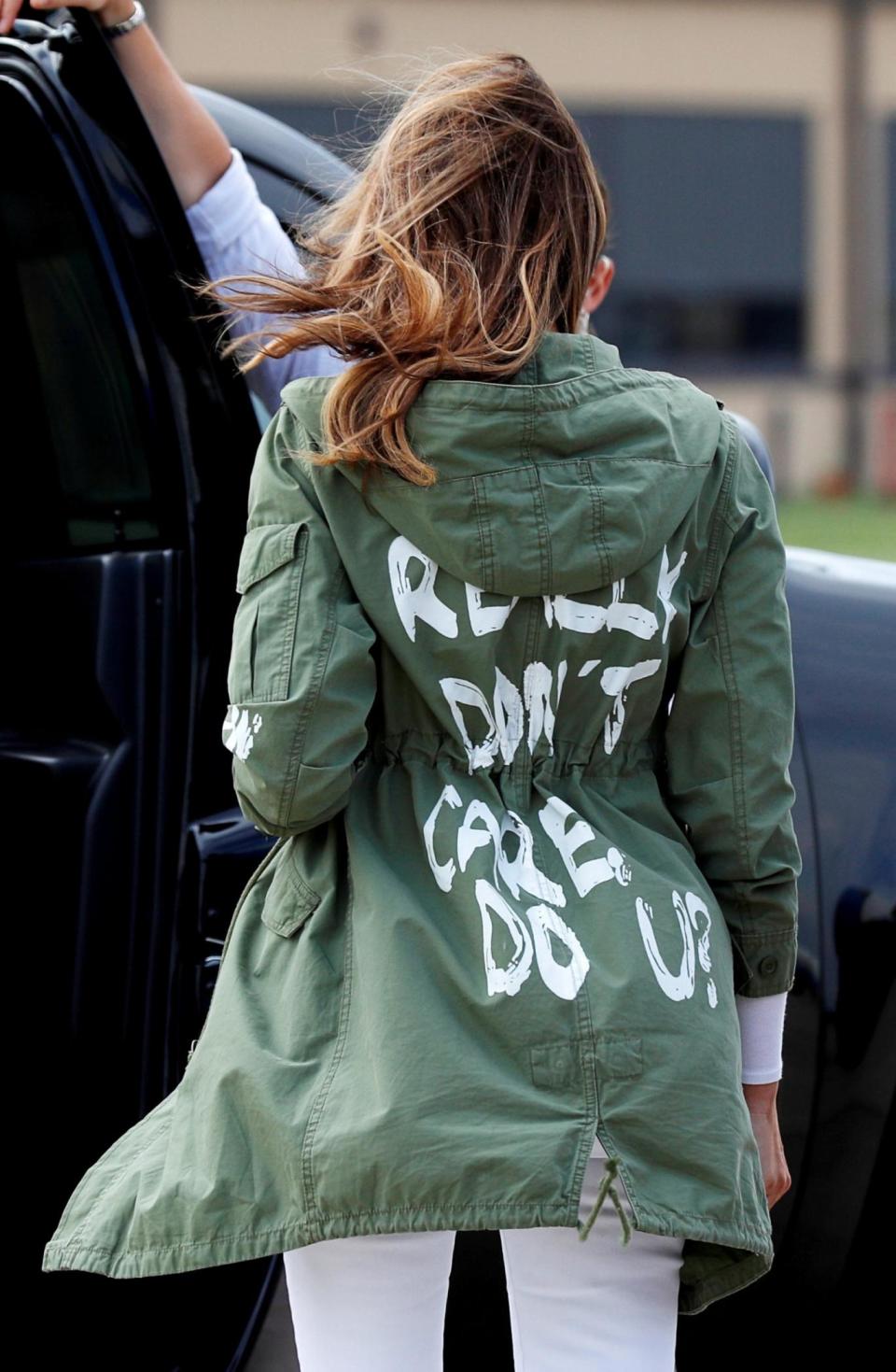 U.S. first lady Melania Trump walks from her airplane to her motorcade wearing a Zara design jacket with the phrase