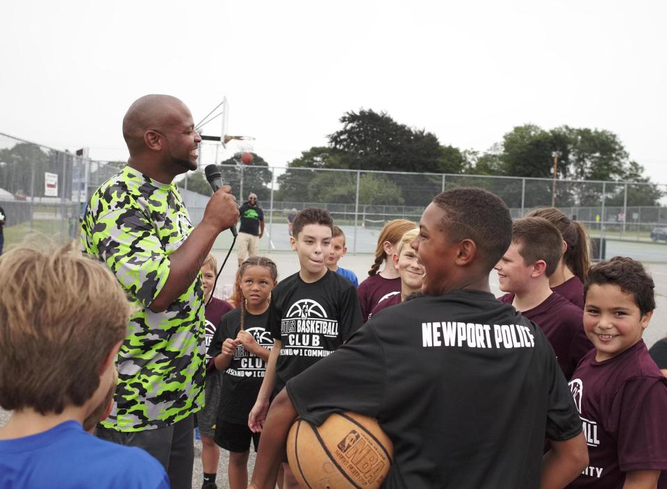 Butler Basketball Club founder Randy Butler speaks before the "One Island, One Community" basketball game in 2019.