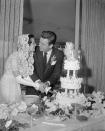 <p>Natalie Wood and Robert Wagner cut into their wedding cake during their first wedding. The couple—who divorced and married again in 1972—tied the knot in Scottsdale, Arizona. </p>