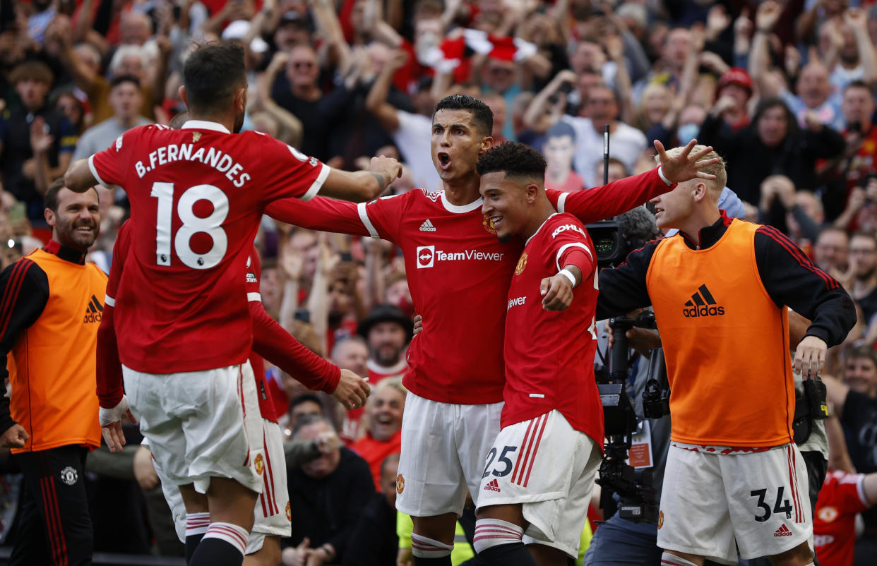 Manchester United's Cristiano Ronaldo celebrates scoring their second goal with his new teammates. 