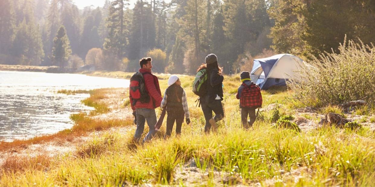 affordable weekend getaways- family walking to campsite