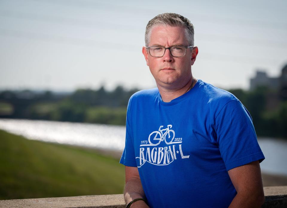RAGBRAI Director Matt Phippen stands for a photo on the SW 1st St. trail bridge, Tuesday, June 20, 2023. 