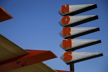 Signage is displayed outside Norms Diner on La Cienega Boulevard in Los Angeles, California May 20, 2015. REUTERS/Patrick T. Fallon