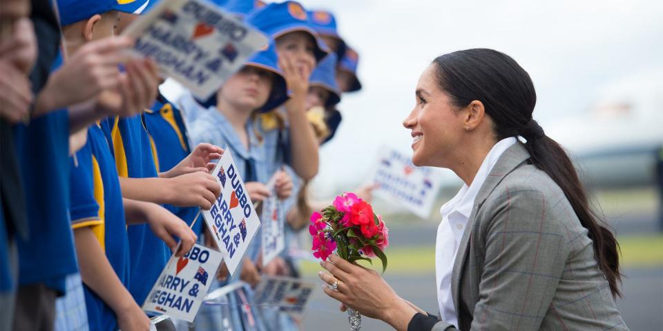 <p>Meghan meets school children, while wearing a jacket by her bestie <a rel="nofollow noopener" href="https://www.harpersbazaar.com/celebrity/latest/a23843155/meghan-markle-serena-williams-blazer-australia-tour/" target="_blank" data-ylk="slk:Serena Williams;elm:context_link;itc:0;sec:content-canvas" class="link ">Serena Williams</a>.</p>