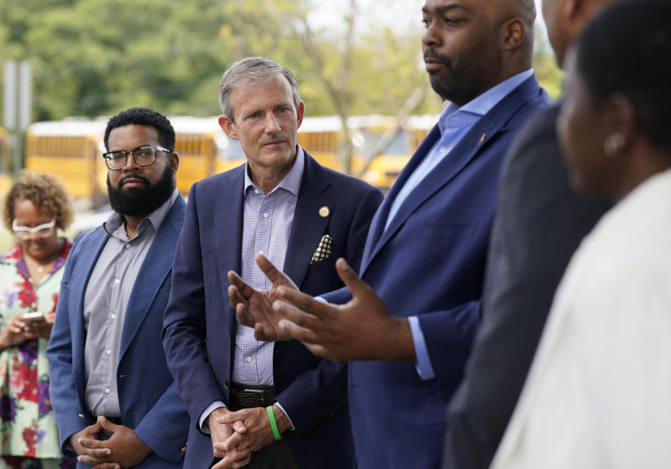 Del. Rodney Willett, D-Henrico, second from left, listens to State Sen. Lamont Bagby, right, during a news conference with Democratic lawmakers and candidates Thursday Sep. 21, 2023, in Richmond, Va. Every Virginia legislative seat will be on the ballot in the November election, and both parties see a possible path to a majority. Democratic State Senate candidate Natan McKenzie, left, looks on. (AP Photo/Steve Helber)