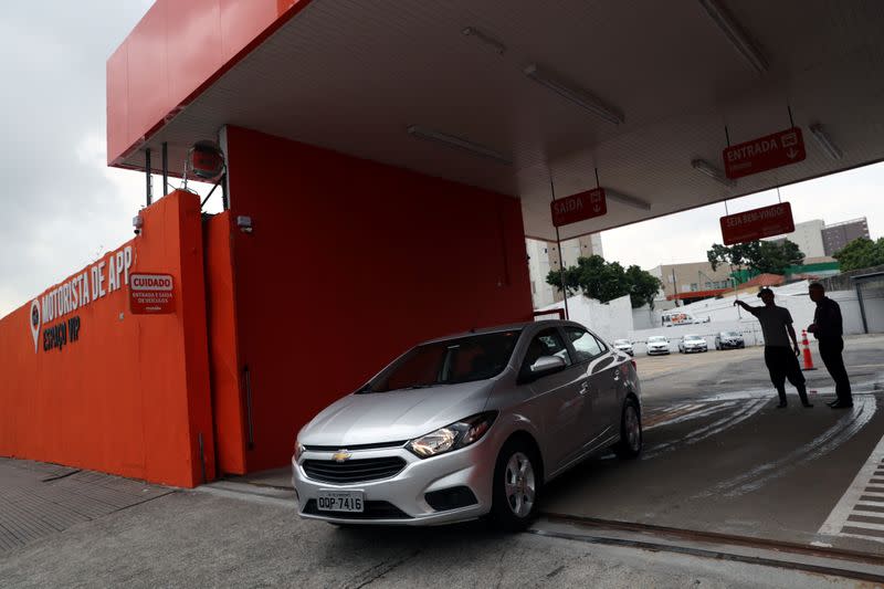 A Chevrolet car is seen in front of a newly opened Movida car rental service store specialised in ride-hailing companies in Sao Caetano do Sul