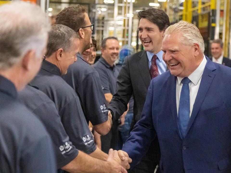  Prime Minister Justin Trudeau and Ontario Premier Doug Ford meet with workers at an auto plant in Ontario.