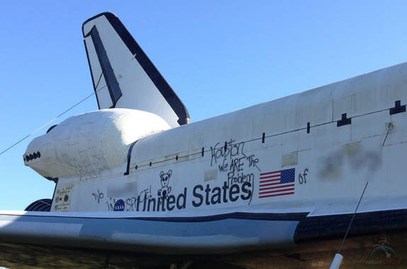 Racial and political graffiti was sprayed on the side of the space shuttle Independence replica at Space Center Houston on Wednesday, Nov. 27, 2013.