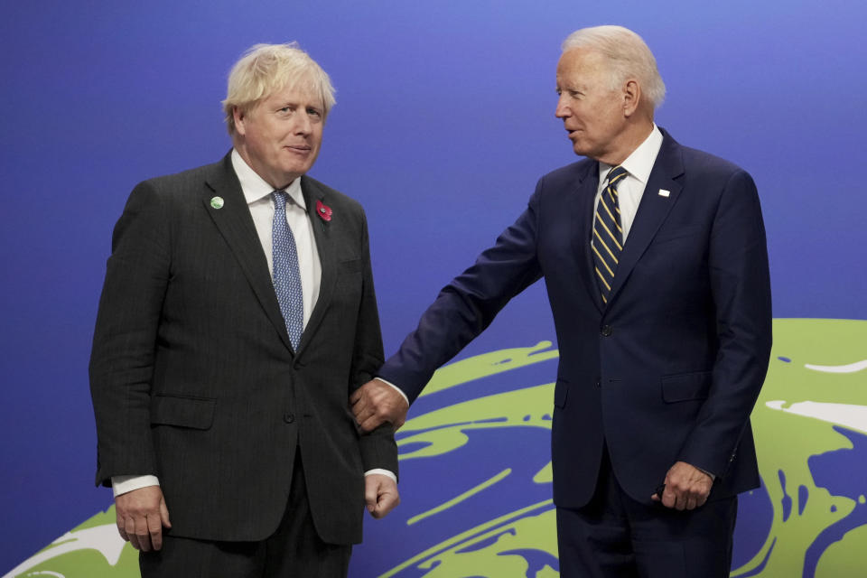 British Prime Minister Boris Johnson, left, greets U.S. President Joe Biden , at the COP26 U.N. Climate Summit in Glasgow, Scotland, Monday, Nov. 1, 2021. The U.N. climate summit in Glasgow gathers leaders from around the world, in Scotland's biggest city, to lay out their vision for addressing the common challenge of global warming. (Christopher Furlong/Pool via AP)